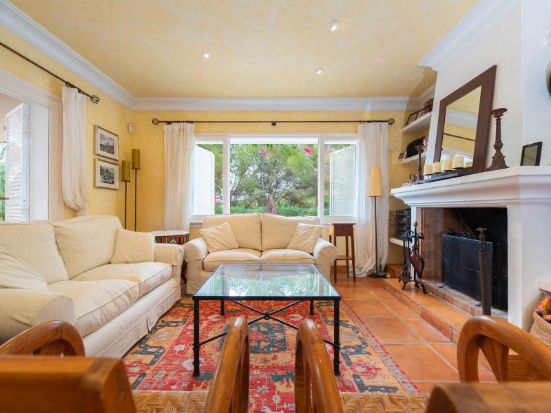 Charming Single-Level Ibiza Home Surrounded by Nature | Luxury real estate listing with stunning ocean view