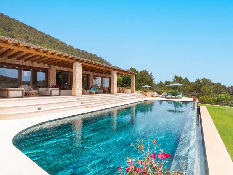 Contemporary Luxury Villa for Sale near San Carlos, Ibiza | Luxury real estate listing with stunning ocean views and modern architecture