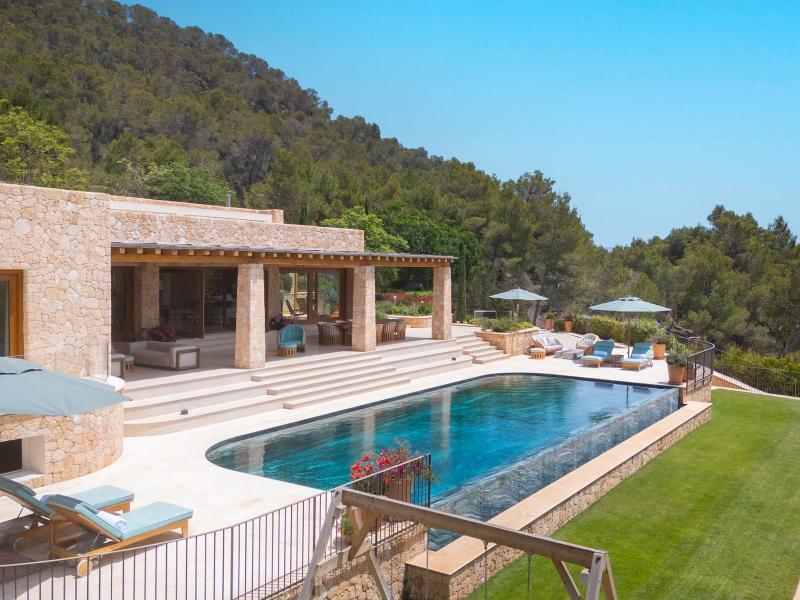 Contemporary Luxury Villa for Sale near San Carlos, Ibiza | Luxury real estate listing with outdoor pool and ocean view